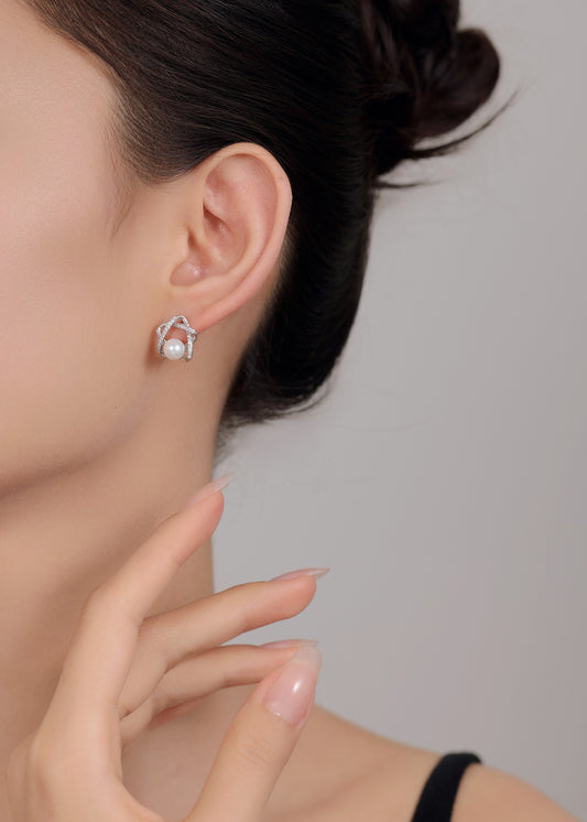 Classic sterling silver pearl studs with star design — perfect for gifting