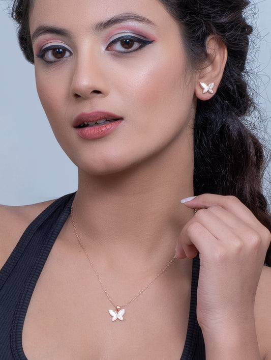 Rose gold butterfly pendant set adorned with white Swarovski zircons and mother of pearl â elegant jewelry for women.