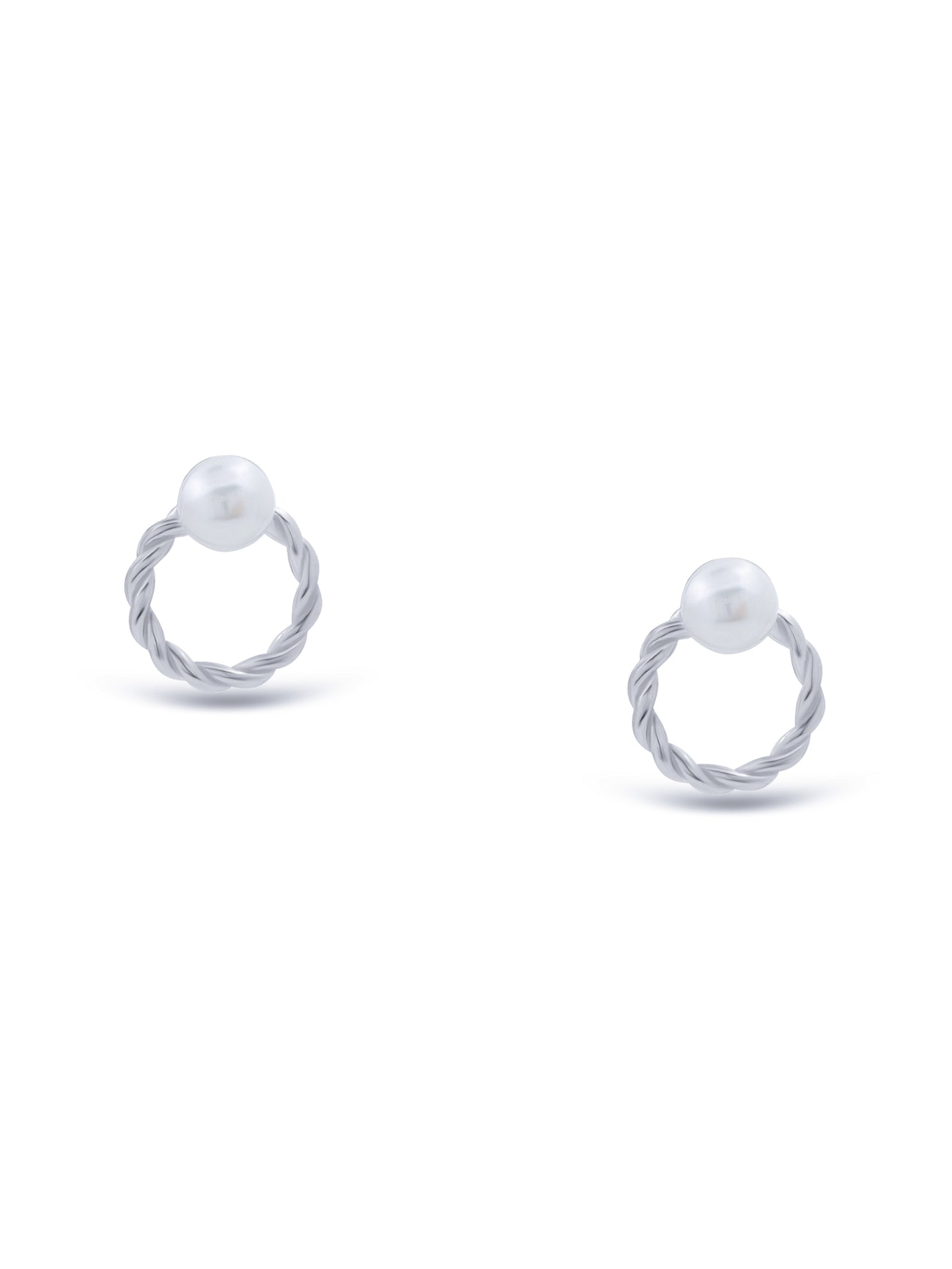 Close-up of sterling silver round-shaped stud earrings with pearl centerpiece.