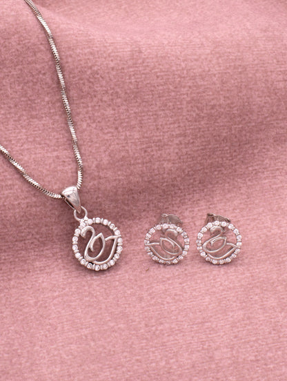 Close-up of silver swan pendant featuring sparkling zircon detailing and curved wings.