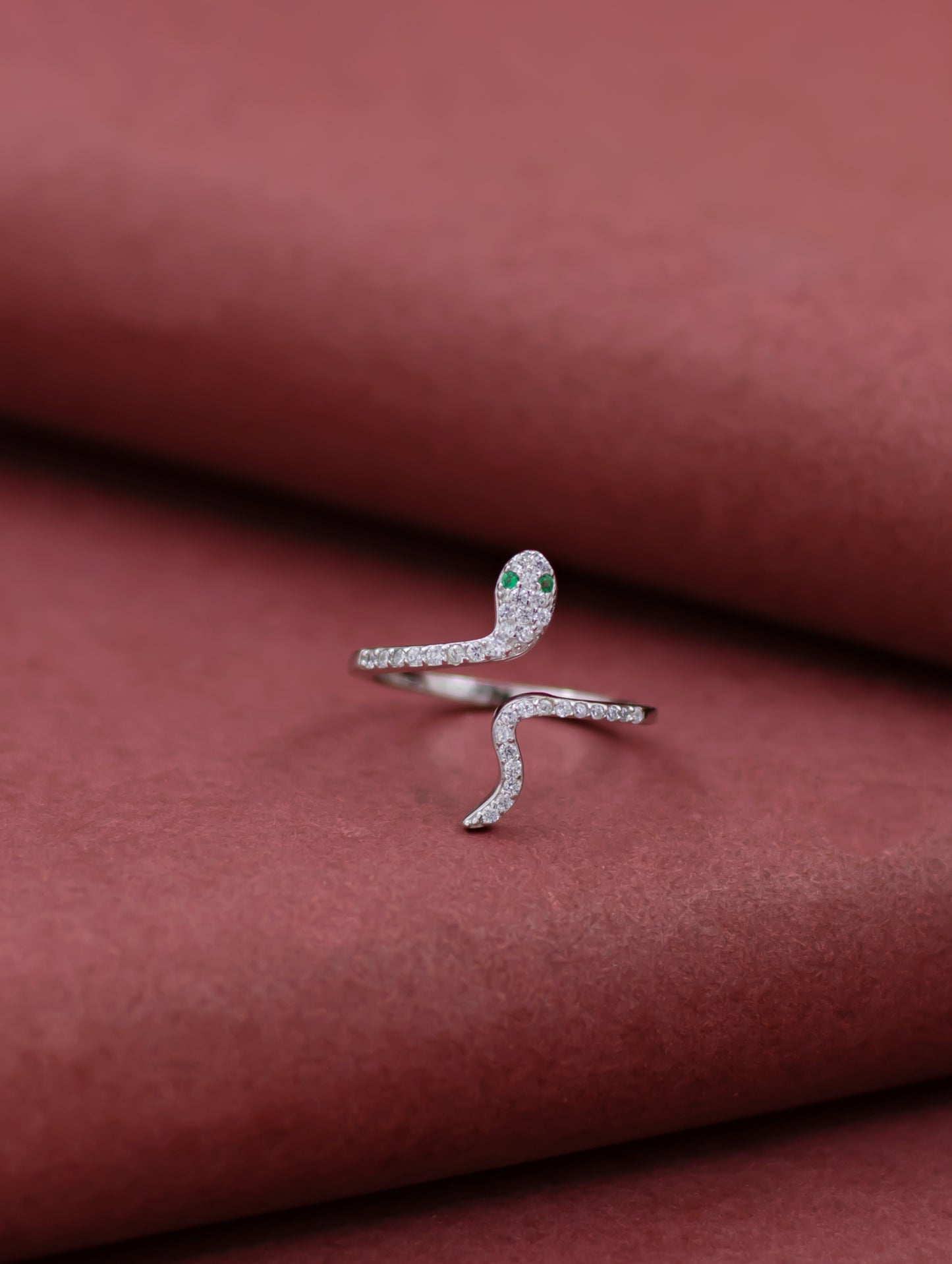 Text (5 options):

Sterling silver adjustable snake ring with white Swarovski zircon.