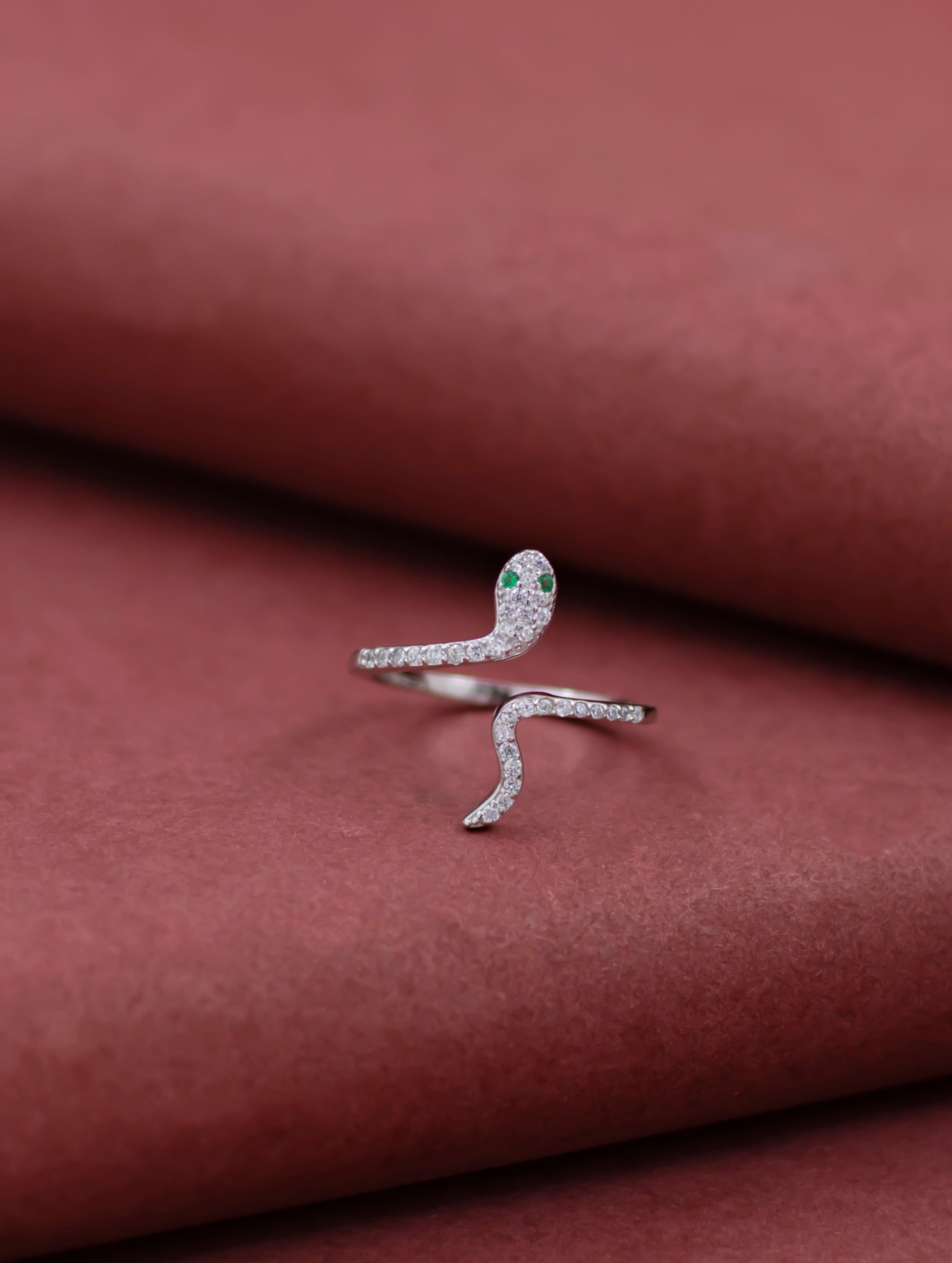 Text (5 options):

Sterling silver adjustable snake ring with white Swarovski zircon.