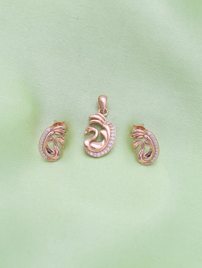 Close-up of rose gold swan pendant with sparkling zircon detailing and curved wings.