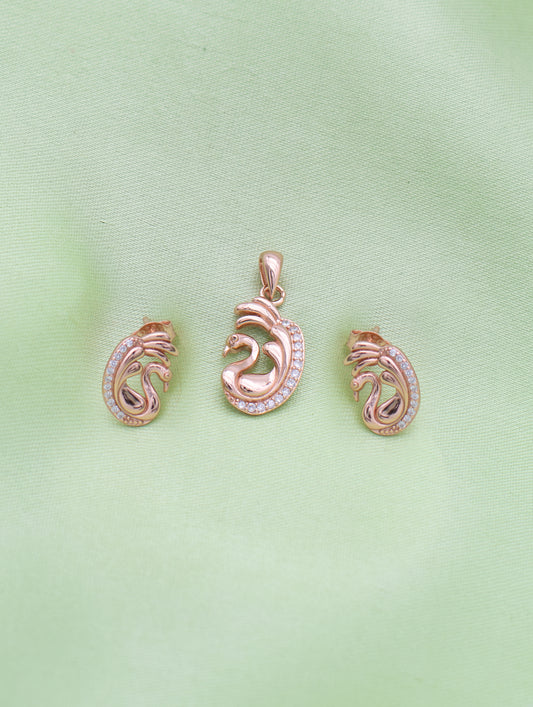 Close-up of rose gold swan pendant with sparkling zircon detailing and curved wings.