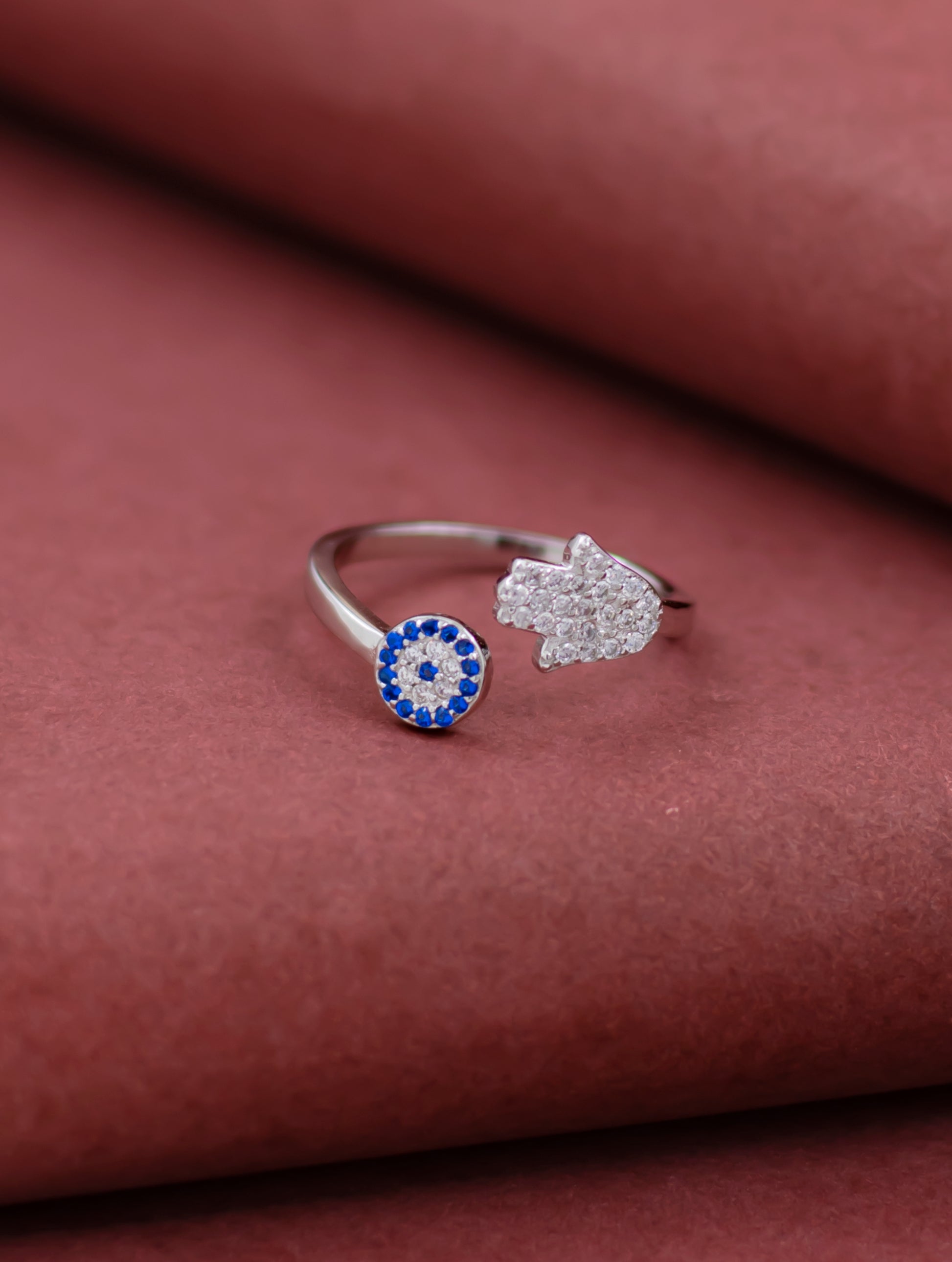 Sterling silver adjustable evil eye ring with blue stone and Swarovski zircons.