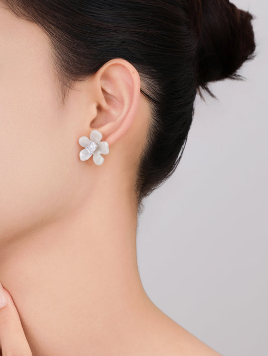 Delicate silver floral studs for everyday and festive wear.