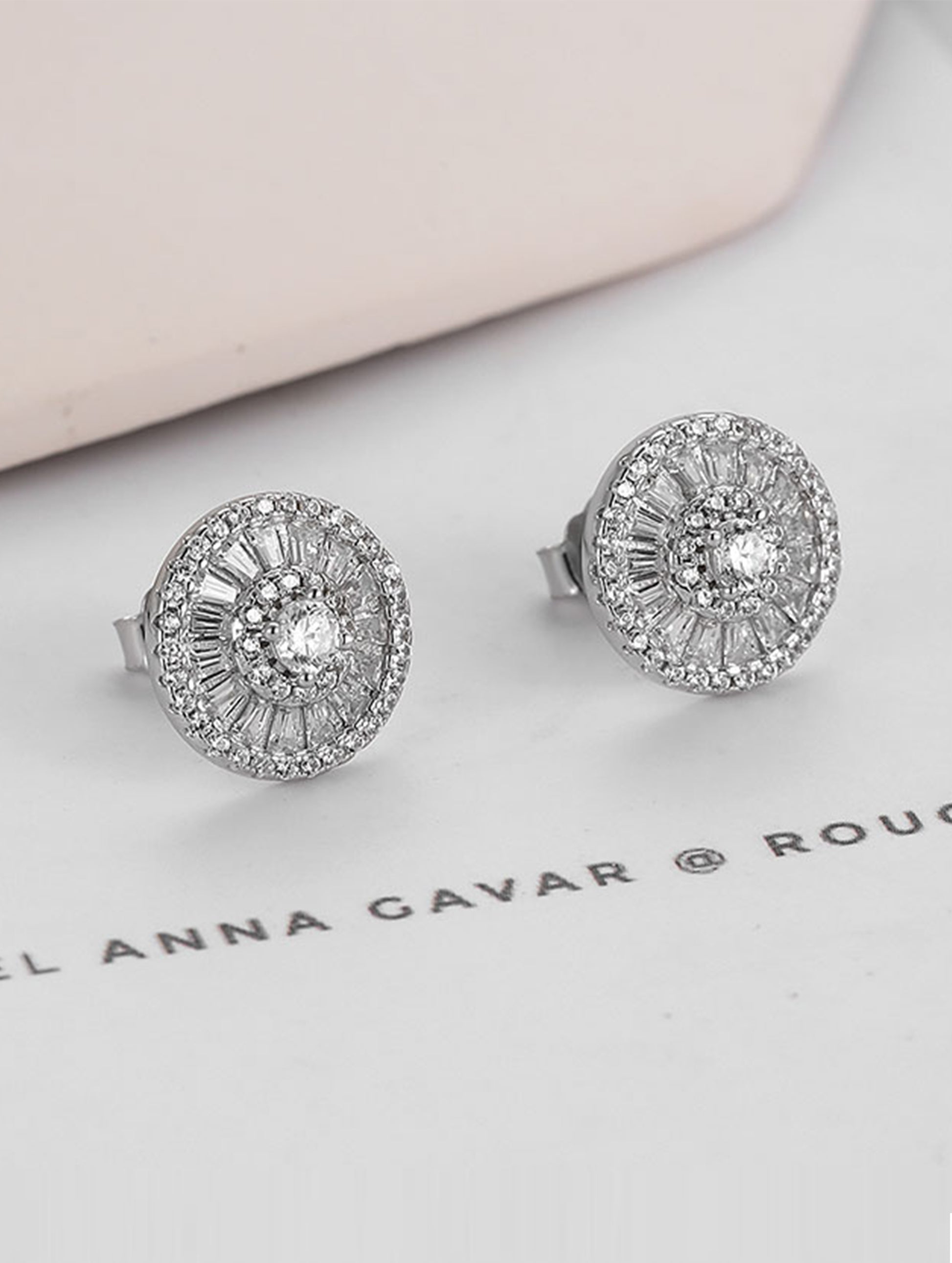 Sterling silver stud earrings with white Swarovski zircon — elegant sparkle.