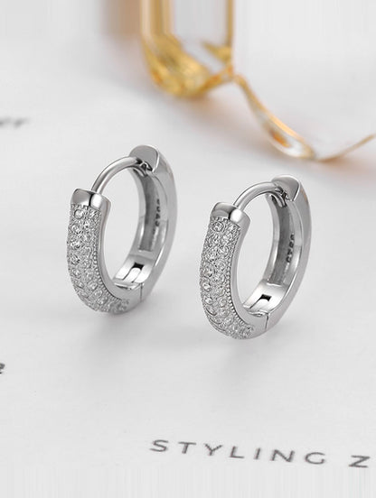 Sterling silver Bali earrings with white Swarovski zircon.