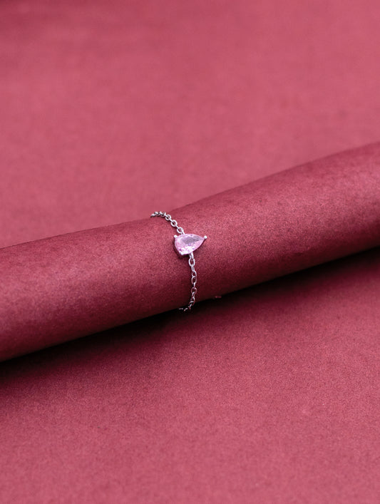 Sterling silver chain ring with drop-shaped purple stone — elegant and sophisticated design.