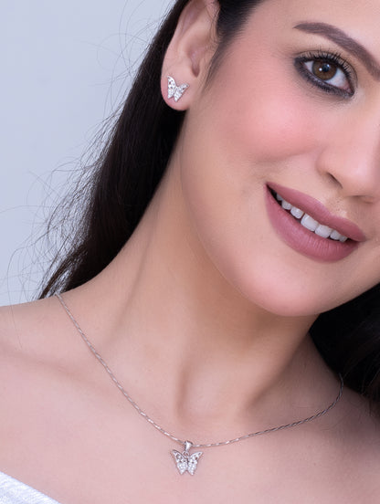 Close-up of silver butterfly necklace with shimmering zircon wings.