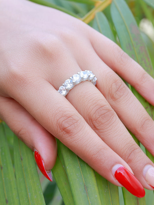 Close-up of silver ring featuring sparkling white Swarovski zircon centerpiece.