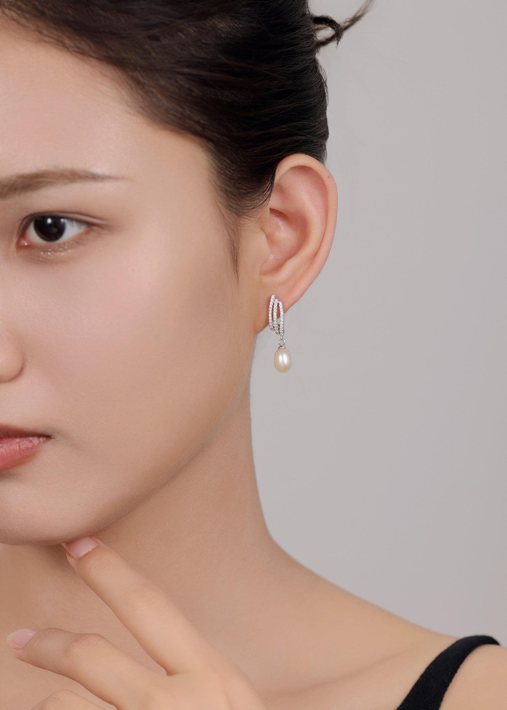 Classic and modern sterling silver pearl drop earrings for women.