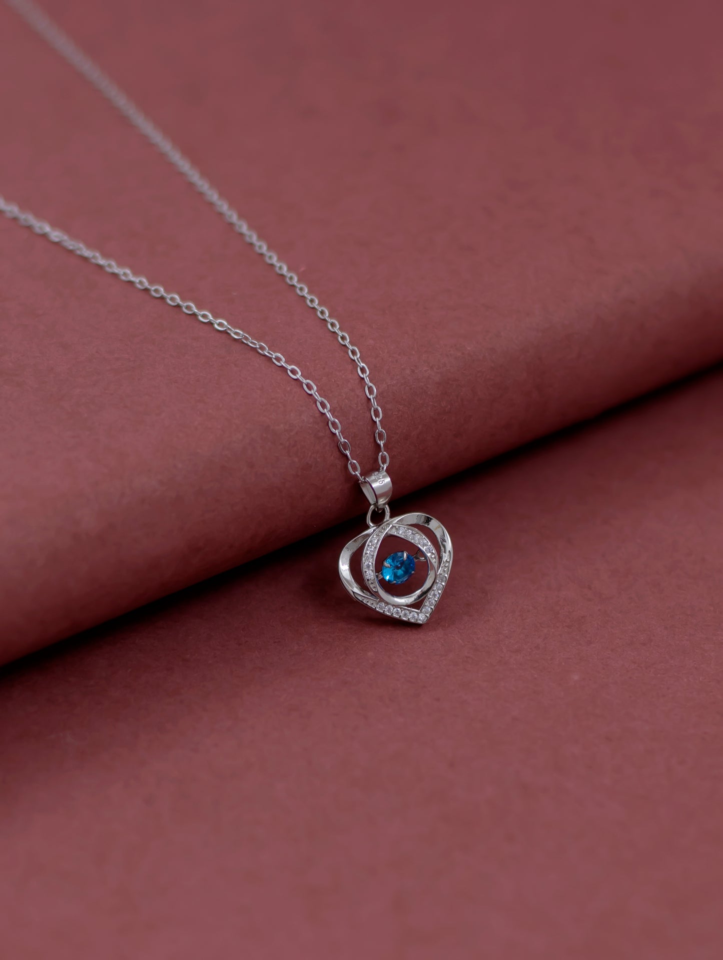 Sterling silver heart pendant chain with blue stone and Swarovski zircon.
