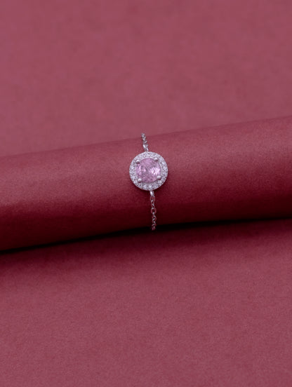 Adjustable sterling silver chain ring with round pink stone and Swarovski zircon accents.