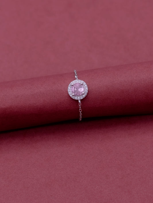 Adjustable sterling silver chain ring with round pink stone and Swarovski zircon accents.