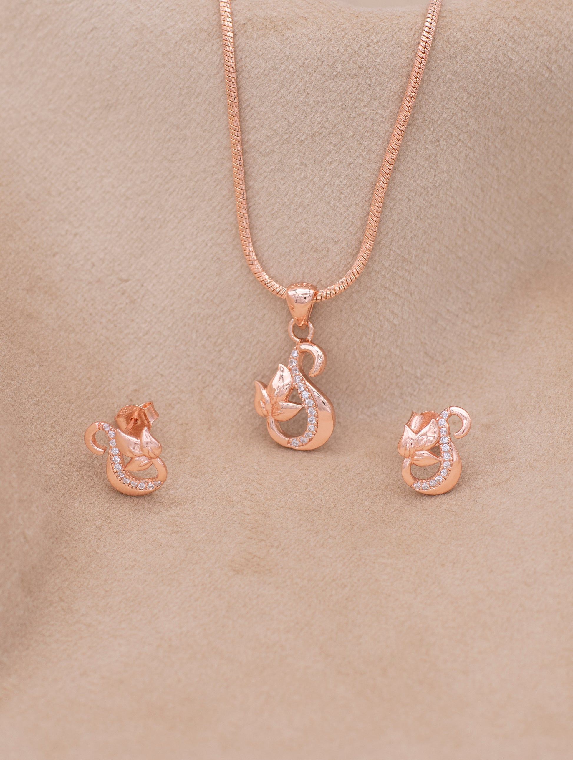 Graceful swan pendant set adorned with shimmering zircons”