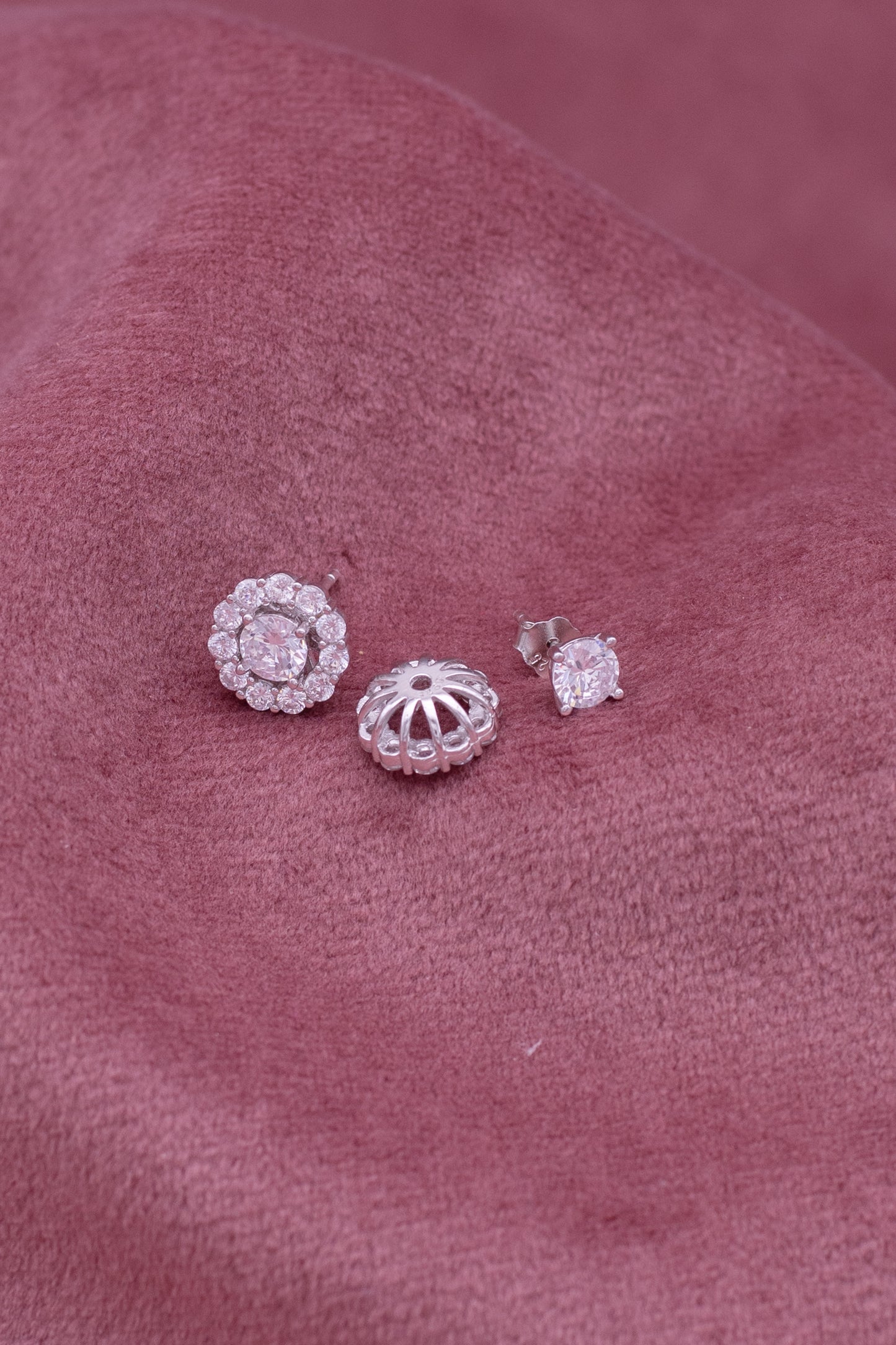 Sterling silver round stud earrings with detachable solitaire and white Swarovski zircon.