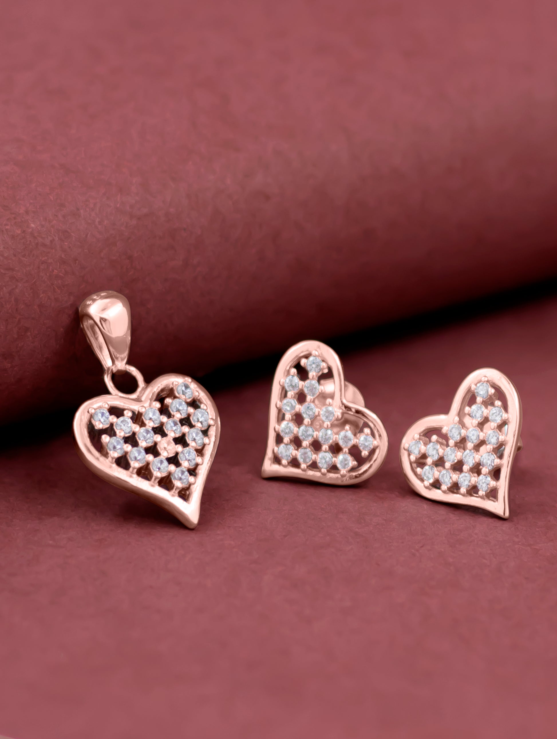 Rose gold heart-shaped pendant set with matching earrings — elegant and romantic jewelry.