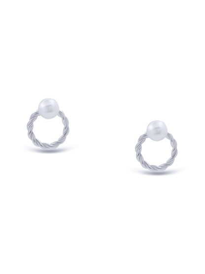 Close-up of sterling silver round-shaped stud earrings with pearl centerpiece.