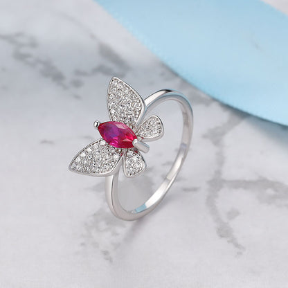 Sterling silver butterfly ring with white Swarovski zircon and pink stone.