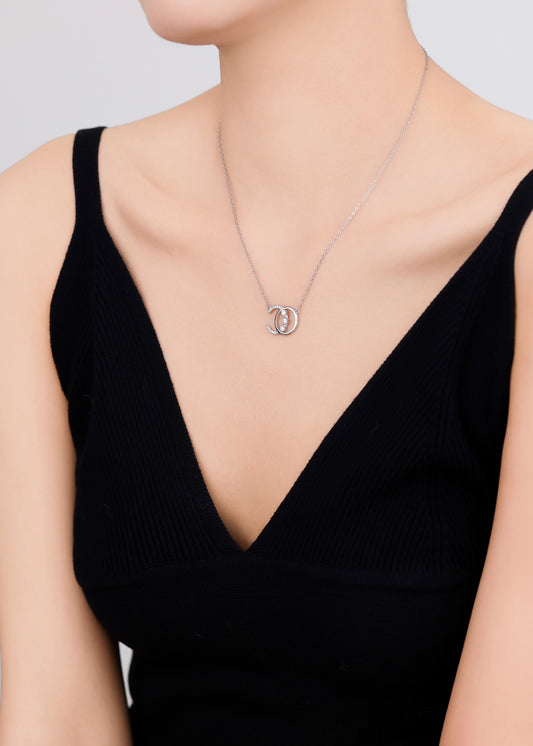 Elegant silver necklace featuring a sparkling Swarovski pendant.