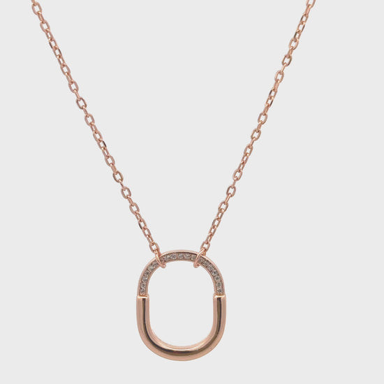 Minimalist silver and rose gold necklace with zircon stones.