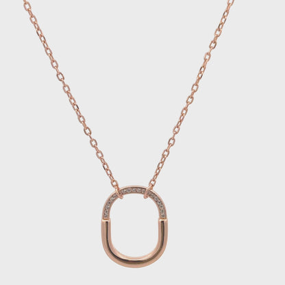 Minimalist silver and rose gold necklace with zircon stones.