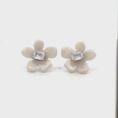 Delicate silver floral studs for everyday and festive wear.