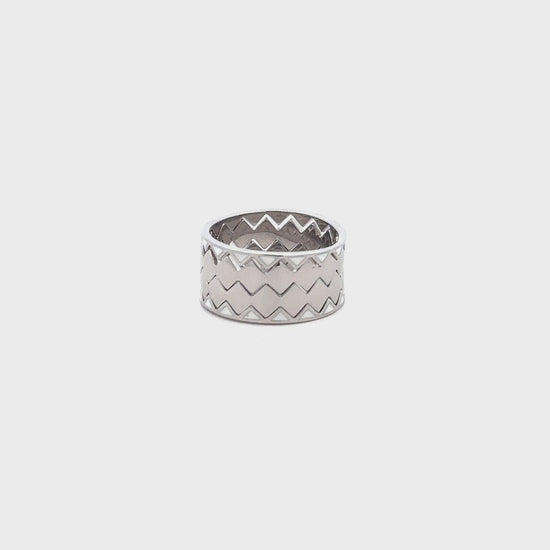 Elegant silver ring combining four bands into one seamless piece.