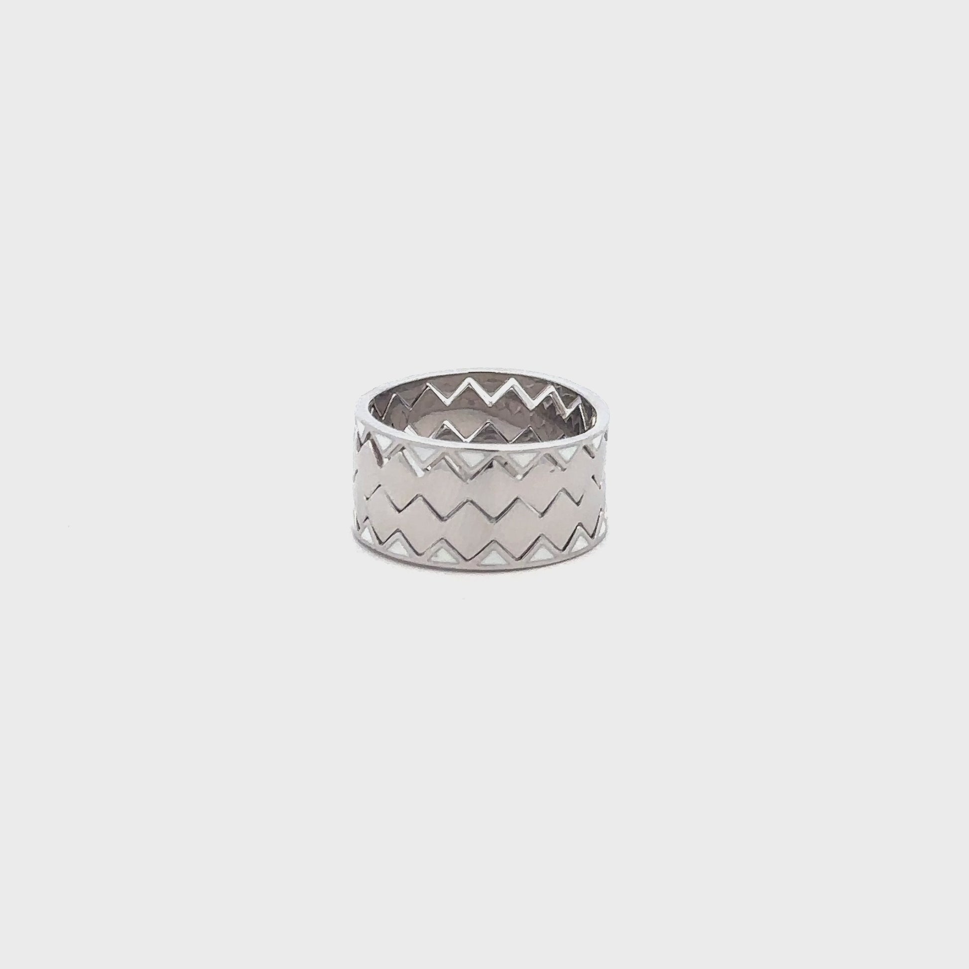 Elegant silver ring combining four bands into one seamless piece.