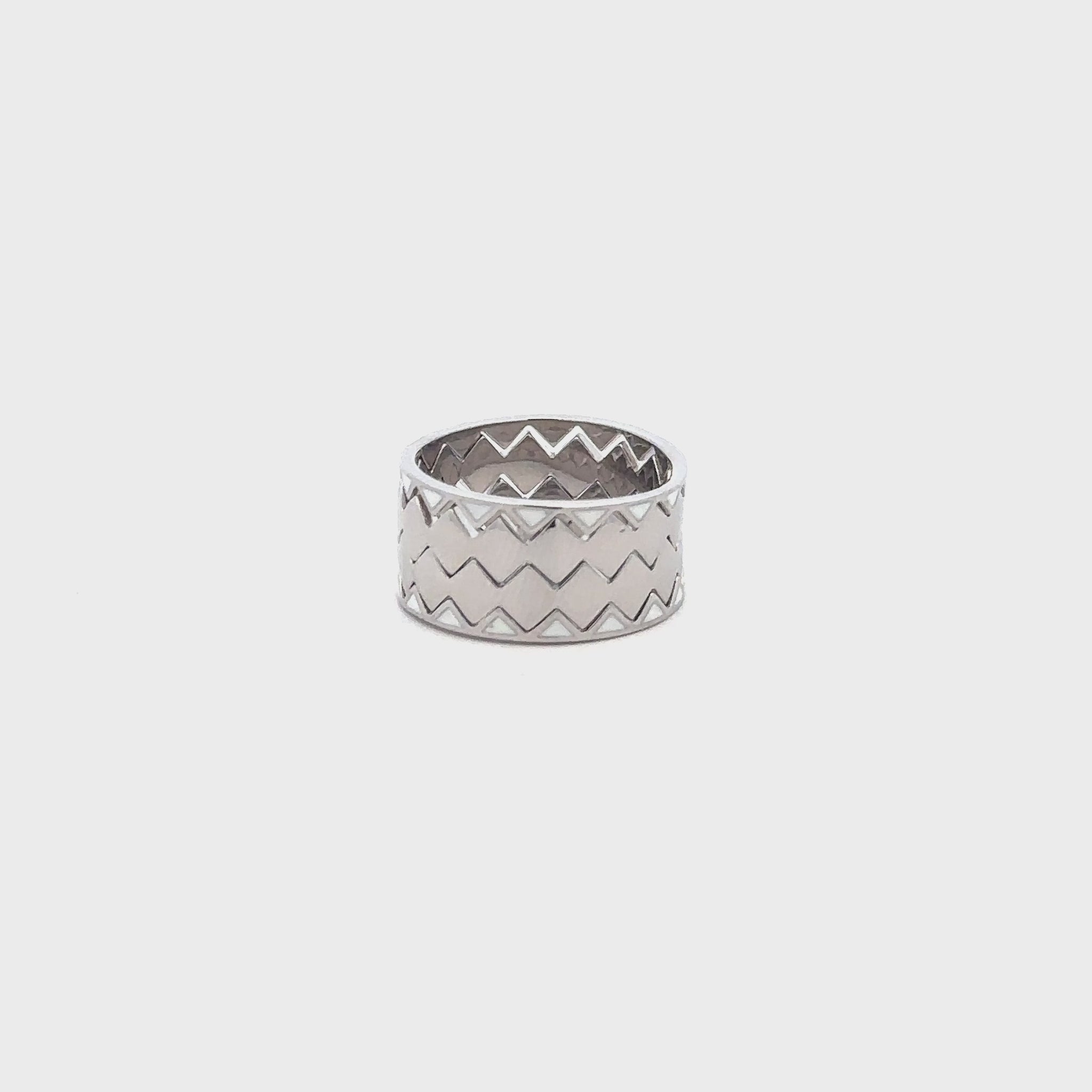 Elegant silver ring combining four bands into one seamless piece.