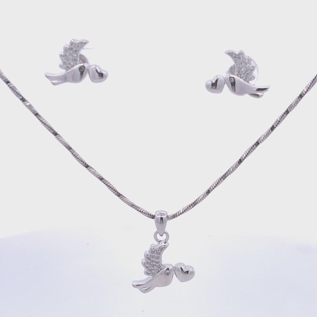 Bird pendant and matching earrings set in sterling silver featuring white Swarovski crystals and heart motif — symbolic and graceful.