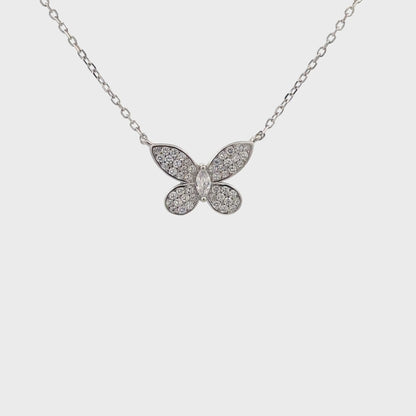 Delicate silver butterfly pendant symbolizing transformation and grace.