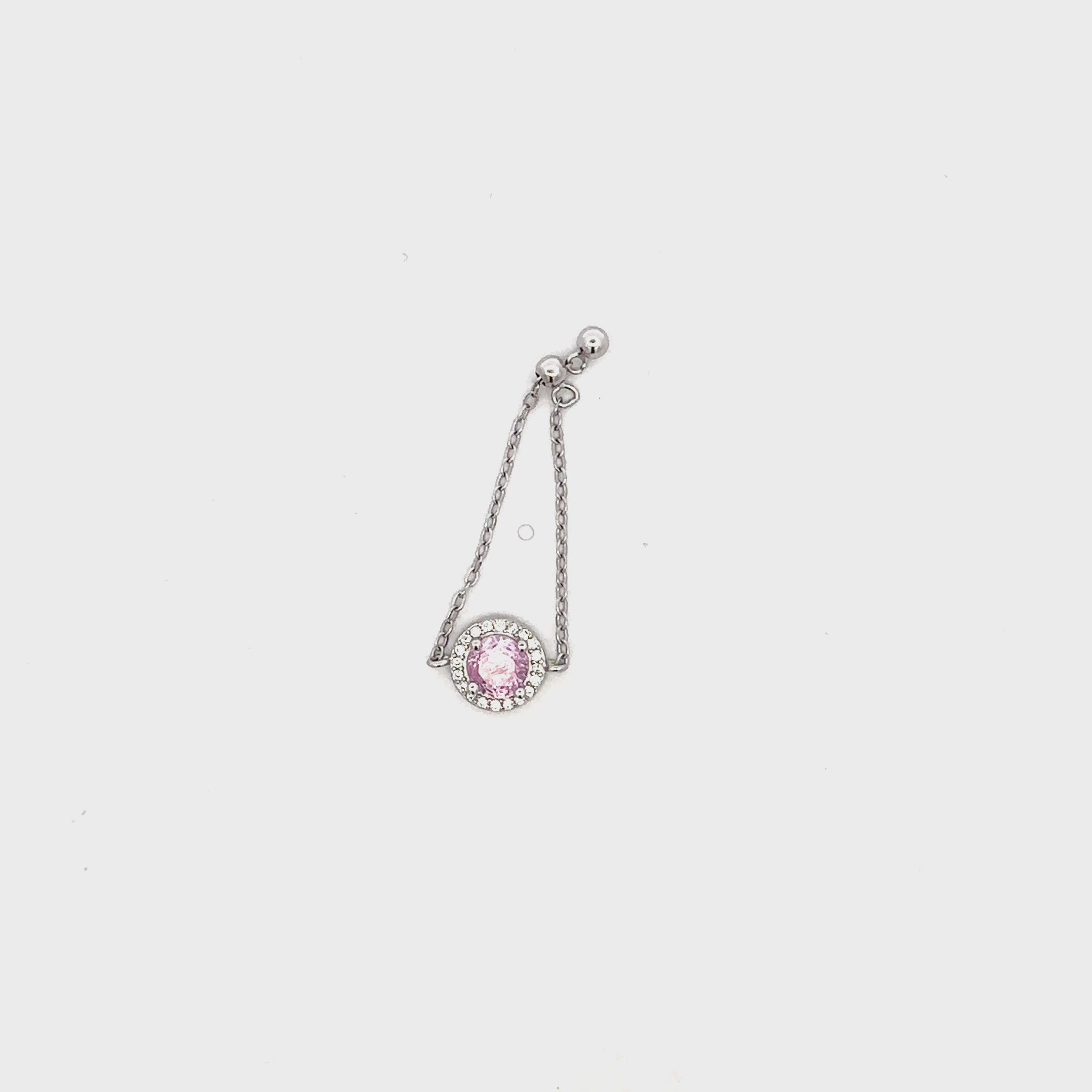 Dainty silver chain ring featuring a semi-precious pink stone and white Swarovski zircons.
