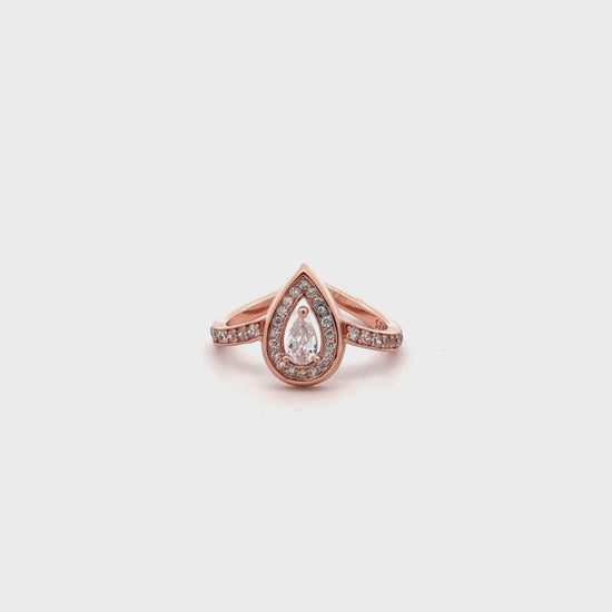 Close-up of rose gold ring featuring solitaire Swarovski zircon in a drop-shaped setting.