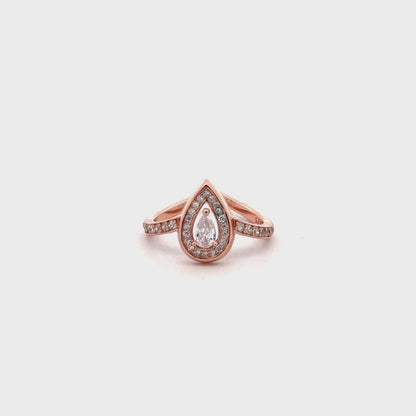 Close-up of rose gold ring featuring solitaire Swarovski zircon in a drop-shaped setting.