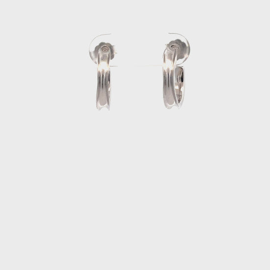 Intricate silver hoops with artisan craftsmanship.